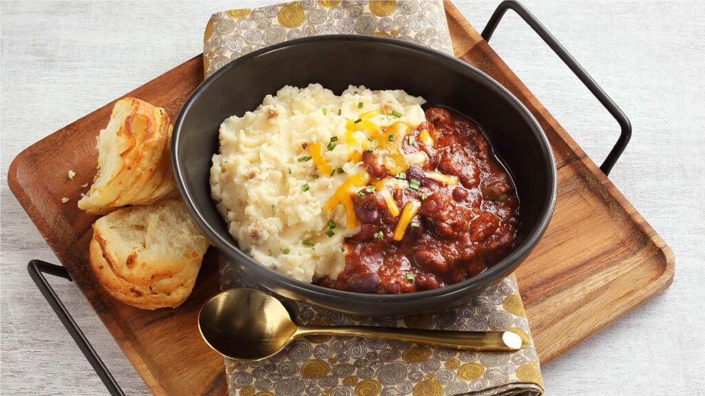 Loaded Baked Mashed Potatoes with Chili and Cheese