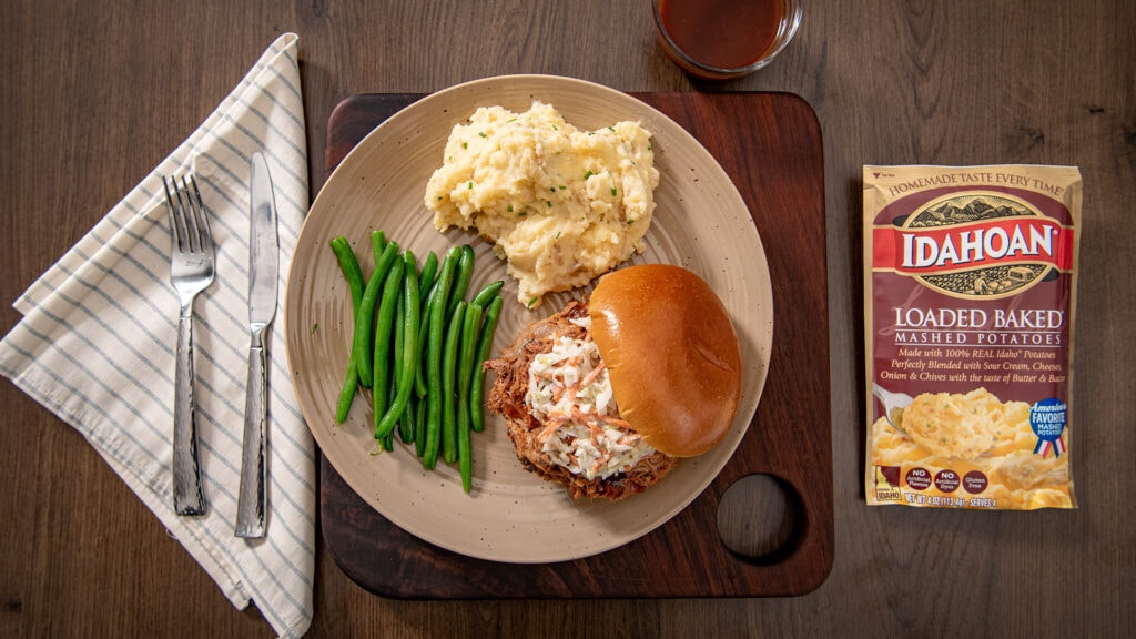 Idahoan Loaded Baked Mashed Potatoes with pulled pork sandwiches and green beans