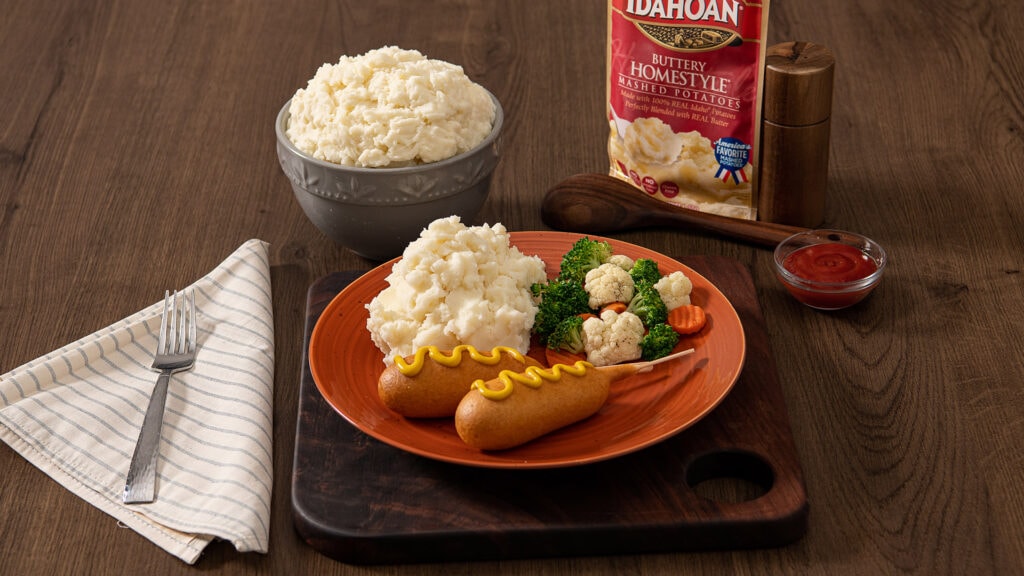 Idahoan Buttery Homestyle Mashed Potatoes with corndogs and mixed veggies